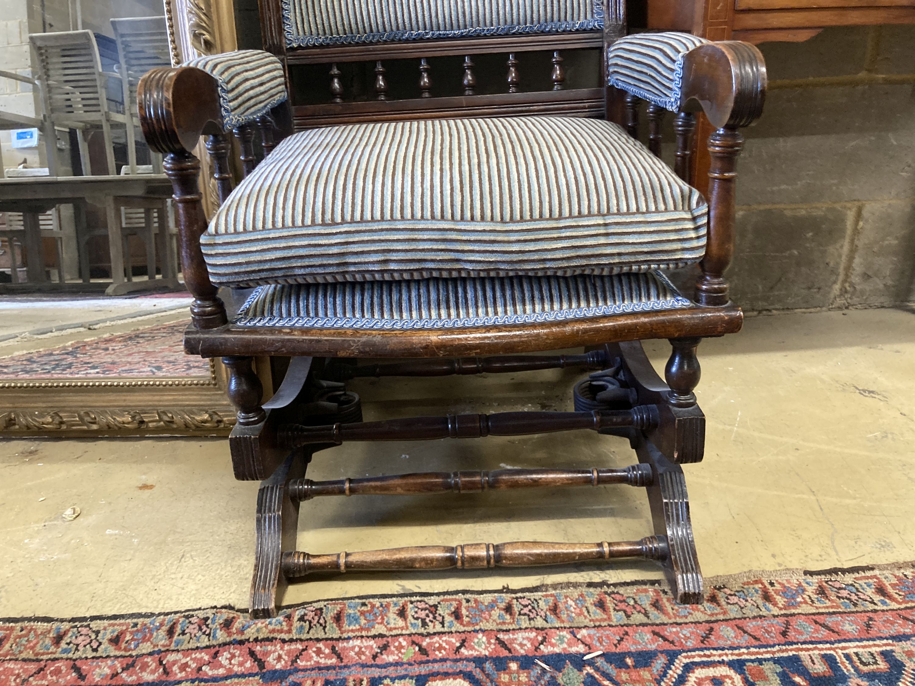 An early 20th century American mahogany rocking chair, width 60cm, depth 52cm, height 108cm